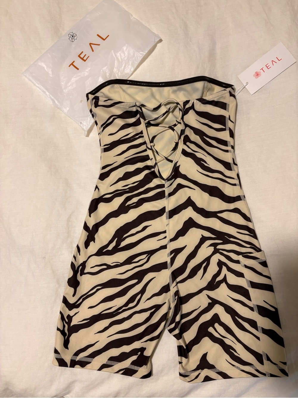 Abt active by teal !!!! Strapless Zebra-Print Romper in Cream